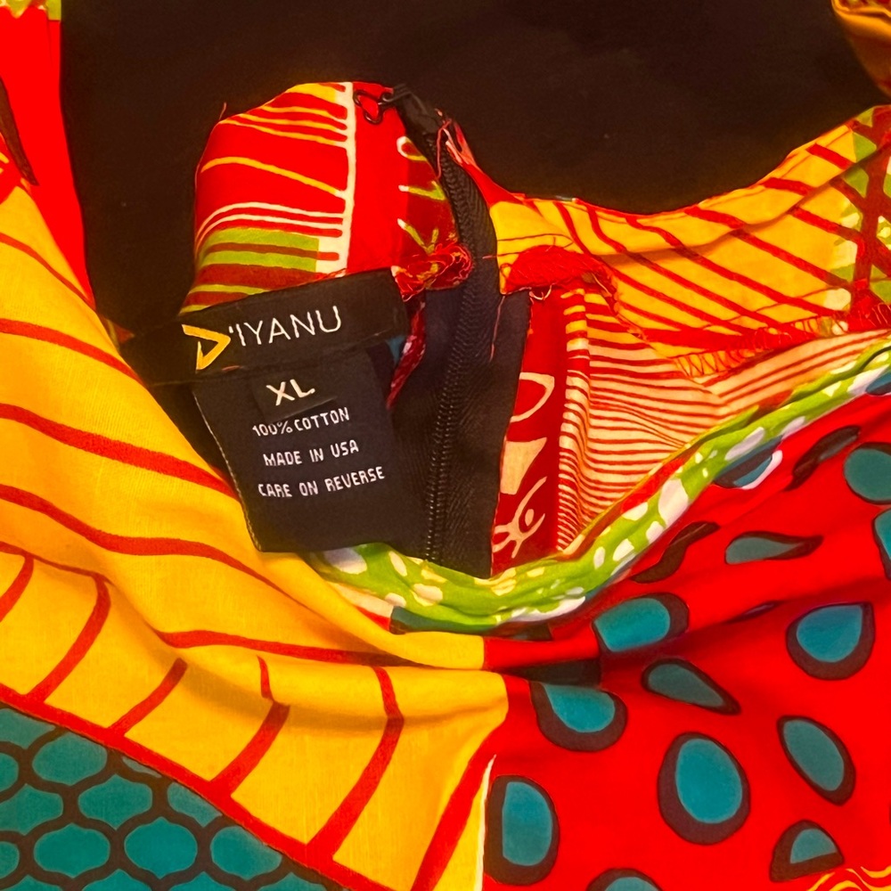 XL D’iyanu mid-length swing skirt. Extra large with zip up in back, fitted waist